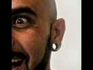 https://image.noelshack.com/fichiers/2012/43/1351022141-man-with-earring-plug-gauge.jpg