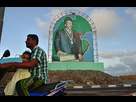https://image.noelshack.com/minis/2017/33/3/1502835785-4837035-6-5398-devant-un-poster-du-president-djiboutien-bbcc78d9737f2858bac3d9ced37f2852.png