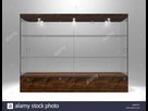 https://image.noelshack.com/fichiers/2021/40/4/1633640407-un-ecran-en-verre-rectangulaire-vide-armoire-avec-base-en-bois-et-couvercle-et-etageres-en-verre-sur-un-fond-de-studio-isole-le-rendu-3d-hm9ptc.jpg