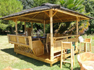 https://image.noelshack.com/fichiers/2021/53/7/1609693558-banc-de-jardin-2-places-5-paillote-de-jardin-en-bambou-laguna-bar-10-14-personnes-800x595.jpg