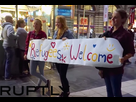 https://image.noelshack.com/fichiers/2022/25/6/1656160547-refugees-welcome-sign-germany-ruptlyyoutube.jpg