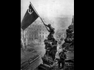 https://image.noelshack.com/fichiers/2024/12/2/1710884389-raising-a-flag-soviet-banner-over-the-berlin-reichstag-building-ww2-poster-0.jpg