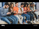 https://image.noelshack.com/fichiers/2024/17/1/1713821211-youth-addicted-for-the-smartphone-and-social-media-networks-young-people-sitting-in-a-bench-holding-and-watching-their-own-smartphones-2baa4c5.jpg