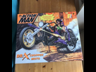 https://image.noelshack.com/fichiers/2024/41/2/1728423823-action-man-dr-x-chopper-moto-boxed-including.jpg